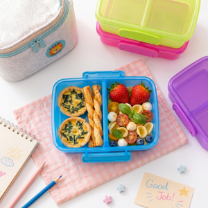 Colorful kids snack container with portioned fruit and vegetables
